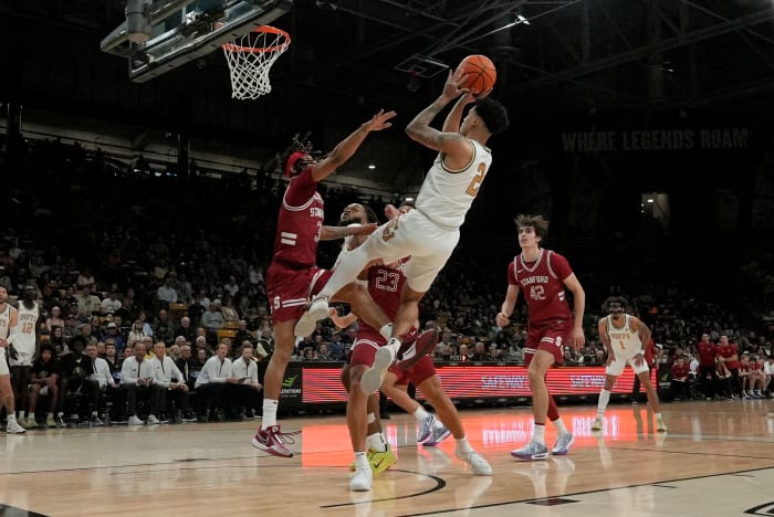 Mar 3, 2024; Boulder, Colorado, USA; Colorado Buffaloes guard KJ Simpson (2) shoots the ball at Stanford Cardinal guard Kanaan Carlyle (3) and Stanford Cardinal in the second half at the CU Events Center. Mandatory Credit: Ron Chenoy-USA TODAY Sports
